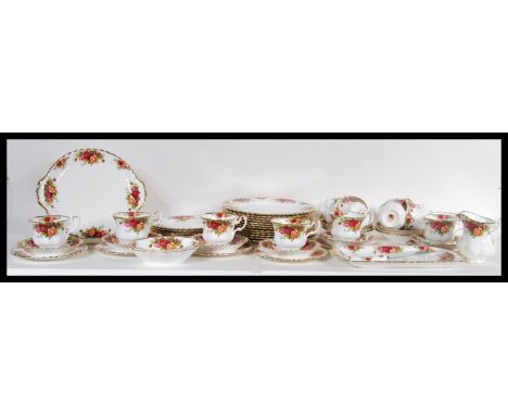 A Royal Albert tea service in the Old Country Roses pattern to include cups and saucers, dinner plates, side plates, cream di