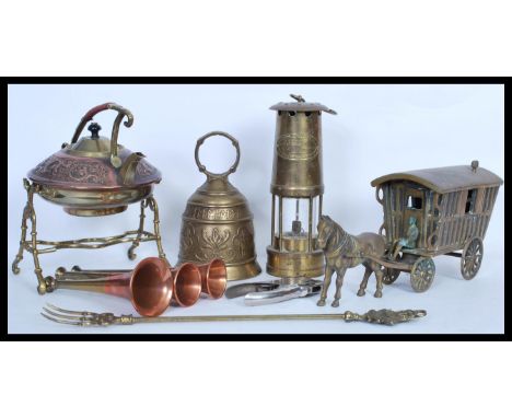 A collection of vintage and antique copper and brass metal wares to include a brass large horse and carriage figurine, copper