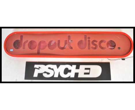 A contemporary retro large light box sign reading Drop Out Disco. The sign of oval form having large bold lettering. Along wi