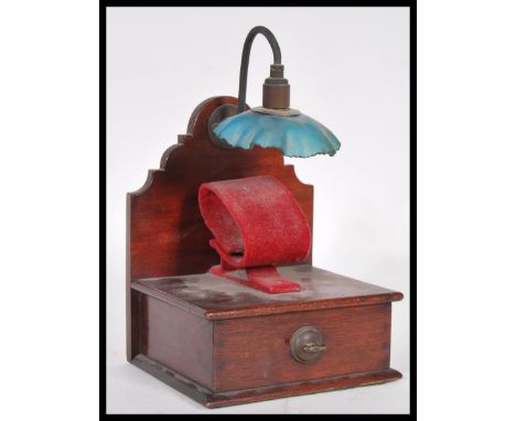 A vintage mid 20th Century shop display watch / bracelet display stand of wooden construction, with a plinth base holding a r