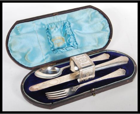 A silver hallmarked Victorian Christening cutlery set to include by&nbsp;Richard Martin &amp; Ebenezer Hall consisting of kni