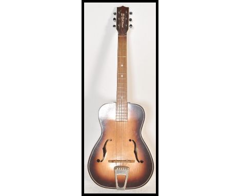 A vintage 1960's / 1970's ' Wonder ' six string acoustic guitar. Steel strings, with F - holes to the sunburst coloured body.