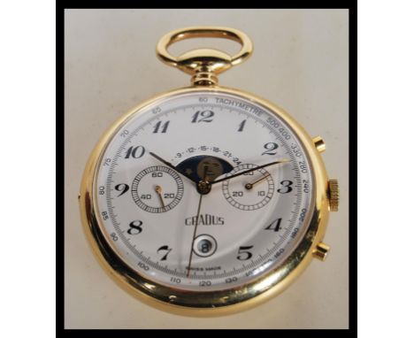 A vintage Gradus chronograph pocket watch having a white enamel dial with twin calendar apertures and moon phase dial over da