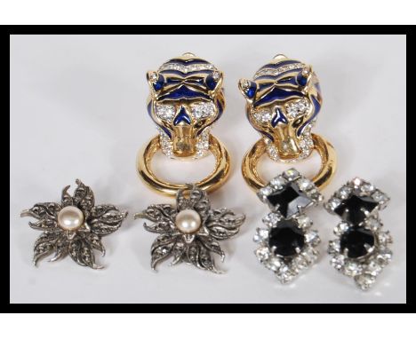 A group of vintage 20th Century designer / costume jewellery dress clips to include a pair of panther clip earrings decorated