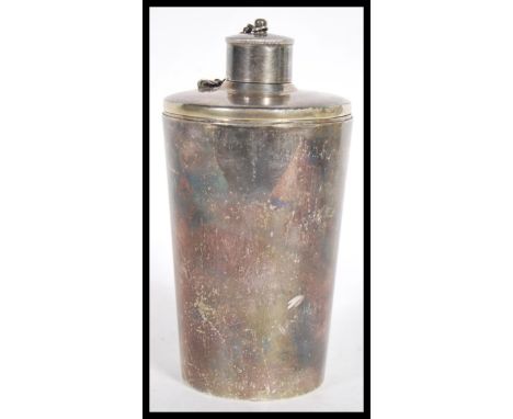 A 20th Century silver white metal hunting interest travelling drinks flask set consisting of a bottle having an attached scre