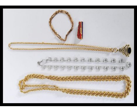 A collection of yellow metal items to include a long plated rope twist chain, length 106cms long, plated chain with swivel ag