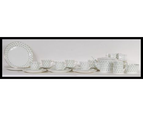A vintage retro Art Deco 1930's Heathcote china tea service in the Blossom pattern, having a white ground with green patterni