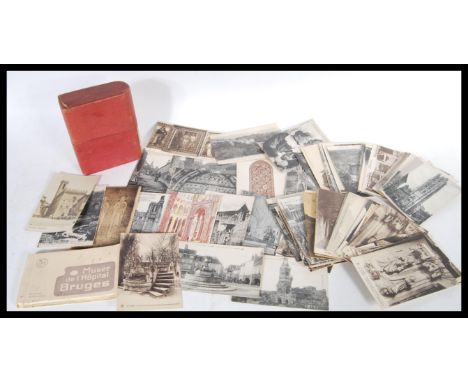 A collection of vintage early to mid 20th Century postcards, mostly black and white architectural images from around Europe o