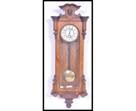A Victorian 19th century large Vienna regulator wall clock with cream enamel dial and subsidiary dial. Pendulum etc&nbsp; in 