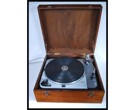A vintage Thorens TD 124/II four speed belt idler drive turntable fitted with a Rega R100 headshell cartridge and fitted with