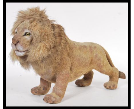 A vintage retro 1960's nodding dog toy in the form of a lion having a rabbits fur mane. Meaasures 17cm high x 28cm width.