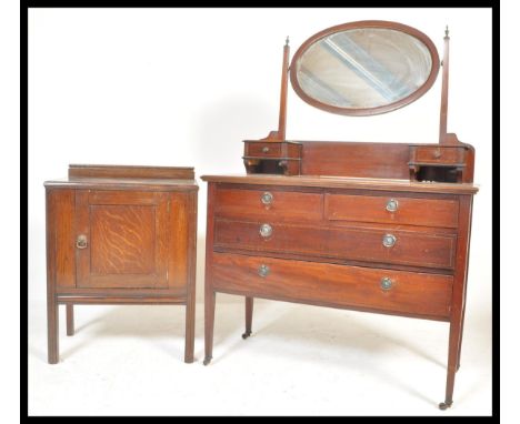 An early 20th Century Edwardian dressing table having two over two drawers with ring handles, on tapering legs terminating in