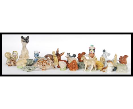 A collection of Wade Whimsy ceramic figurines to include two graduating tortoises, a pegasus figurine, Peg from Lady and the 