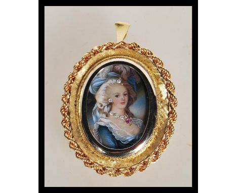 An 18ct gold / 750 marked portrait necklace pendant. The portrait miniature with inset diamonds and ruby to the ladies neckla