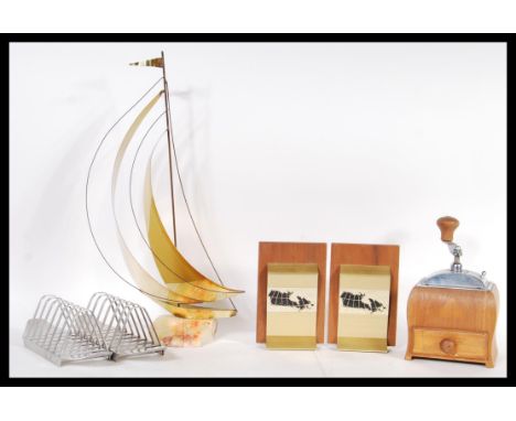 A group of vintage items to include a pair of bookends, brass and teak wood with depictions of the flat earth, coffee grinder