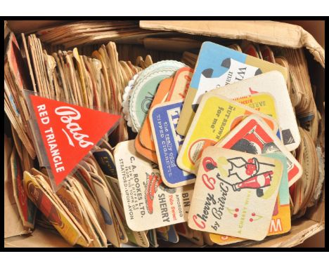 A large collection of vintage 20th Century advertising point of sale beer mats along with an acrylic triangular Bass sign.