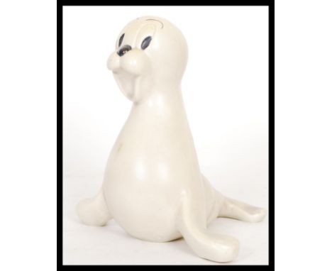 An early 20th Century Art Deco Wade Heath Walt Disney ceramic figurine of Sammy the Seal in the rare white colourway. Printed