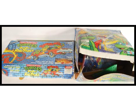 Two vintage Teenage Mutant Hero Turtles sets comprising of an original vintage Kid Works made Teenage Mutant Hero Turtles bat