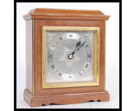 A 20th Century Elliott mantel clock, dial marked Garrard &amp; Co. Ltd., 112 Regent Street, London, having a silvered dial wi