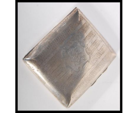 An early 20th Century Edwardian cigarette case by Joseph Gloster. The cheroot case of square cushion form with engine turned 
