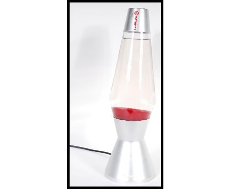 A vintage retro 20th Century Mathmos Astro lava lamp of larger size raised on brushed steel base with red sand interior. Meas