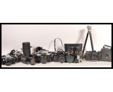 A collection of vintage film cameras and equipment to include a Zorki - 4, minister III, Canon Zoom-S, Praktica super TL, Cor