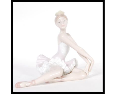 A Lladro ceramic figurine of a Ballerina entitled Ballet Graceful Pose model 06174 complete in original box. Printed and impr