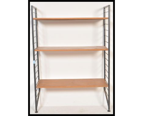 A vintage retro 20th Century Ladderax wall shelving unit having two ebonised ladder sides with three wooden shelves. Measures
