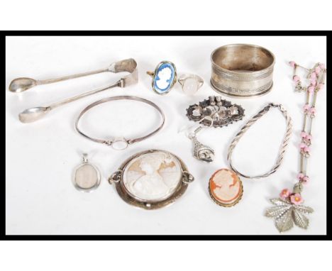 A group of hallmarked silver and sterling silver jewellery to include brooches, cameo, Scottish thistle brooch, moonstone rin