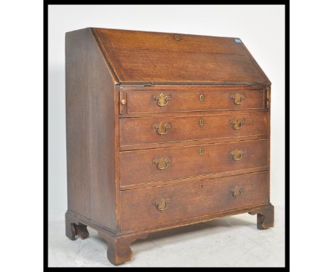 An 18th / 19th Century Georgian country oak&nbsp; fall front bureau, fully appointed interior over four graduating drawers ra