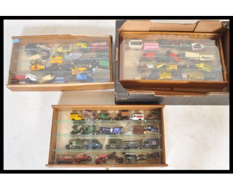 A large collection of Lledo and Days Gone diecast models contained with wooden and glass shelved wall mounted display cabinet