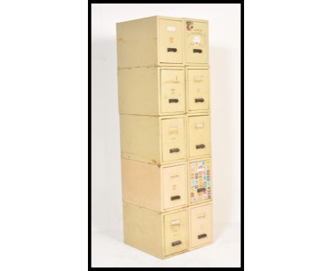 A set of ten vintage retro 20th Century Industrial metal upright filing cabinets in a cream enamel finish by Arnselock having