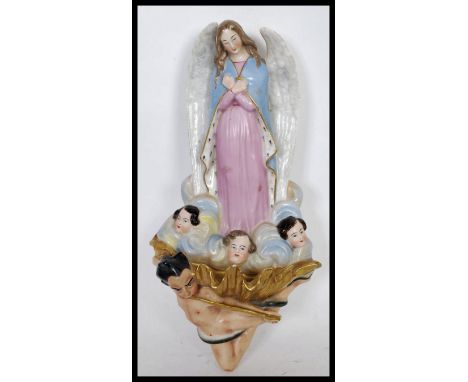 A 20th Century Italian ceramic Ecclesiastical Church Holy Water Font having gilded bowl with trumpeter to base. The back deco