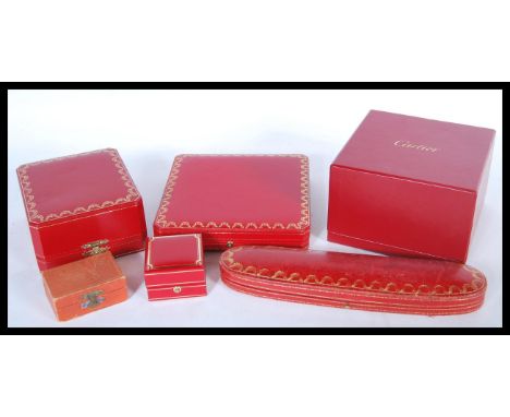 A collection of six red Cartier jewellery boxes to include two necklace boxes with gilt garland decoration, a pocket watch bo