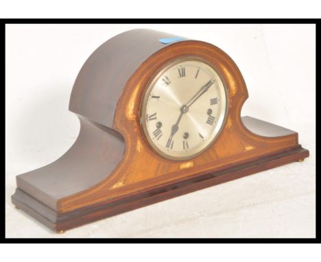 An early 20th Century Napoleon's hat / dome top mahogany mantel clock having box wood inlaid decoration, silvered dial and Ar
