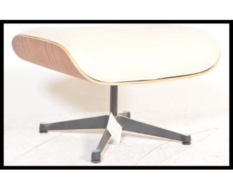 After Charles &amp; Ray Eames - Plycraft - A contemporary lounge chair ottoman comprising of Palisander plywood shell with wh