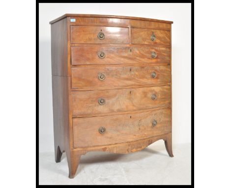 An early 19th Century Georgian mahogany bow front attic chest of drawers having inlay decorated top. The bank of two over fou