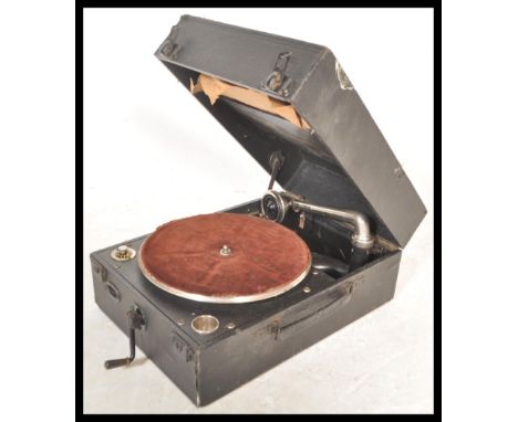 A vintage 20th century portable record player gramophone by Columbia having hinged lid with fitted interior. Along with a qua