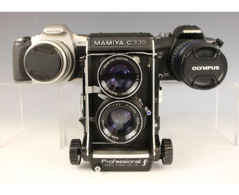 A Mamiya C330 Professional F medium format twin lens reflex camera, fitted with Mamita-Sekor 1:2.8 f=80mm lenses; with a Pent