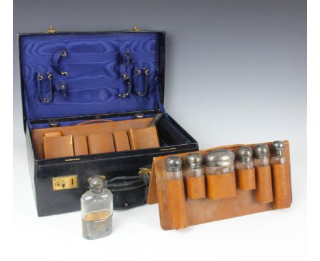A George V silver mounted part travelling vanity set, Walker and Hall, London 1912/13, the various silver mounted dressing ta