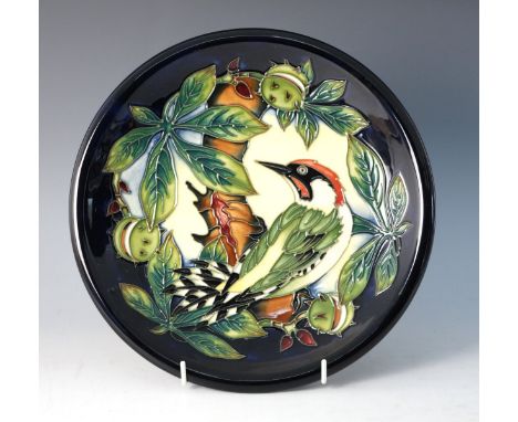 A Moorcroft 'Ingleswood' plate designed by Philip Gibson, impressed and painted maker's marks for 2003 to base, Philip Gibson