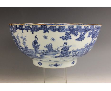 A Chinese porcelain blue and white centre bowl, Qianlong (1735-1796), the circular with ogee moulded rim externally decorated