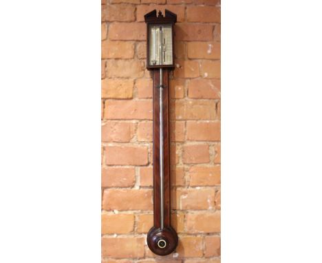 A George III mahogany cased stick barometer, the broken arch pediment above an 18cm silvered register with vernier scale, sig