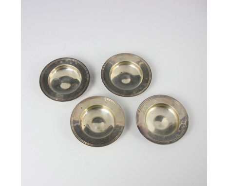 A pair of late 20th century silver trinket dishes, Asprey and Co Ltd, London 1975, of circular form with engraved crest to ri