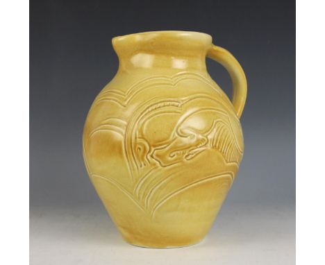 A Susie Cooper Art Deco jug, early 20th century circa 1930, of ovoid form, the body relief moulded with leaping gazelles, inc