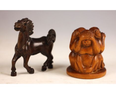 Two Japanese Katabori Netsuke, comprising; a horse, signed, 5.5cm high, and three wise monkeys, signed, 4.5cm high (2)