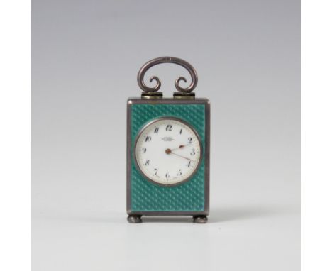 An early 20th century miniature silver and enamel travel clock, by JTC (Geneva Watch Co.) re-tailed by Asprey and Co, the cir