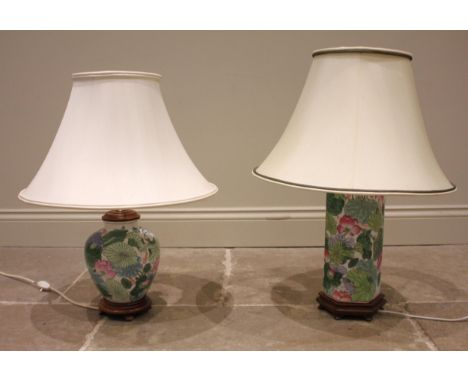 A Chinese vase table lamp, of octagonal form decorated with water lilies, upon a hardwood plinth base, with a bell shaped sha