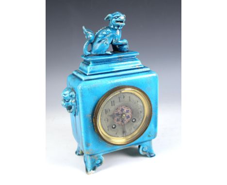 A Victorian Majolica turquoise glazed Chinese influence mantel clock, the ceramic case surmounted with a dog of fo figure, wi