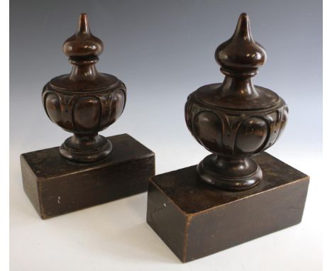 A pair of carved walnut balustrade finials, late 19th century, each carved with strapwork lozenge detail, later attached to h